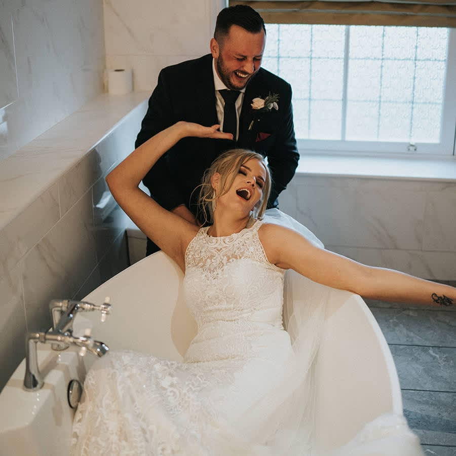 Bride and Groom in Bathroom